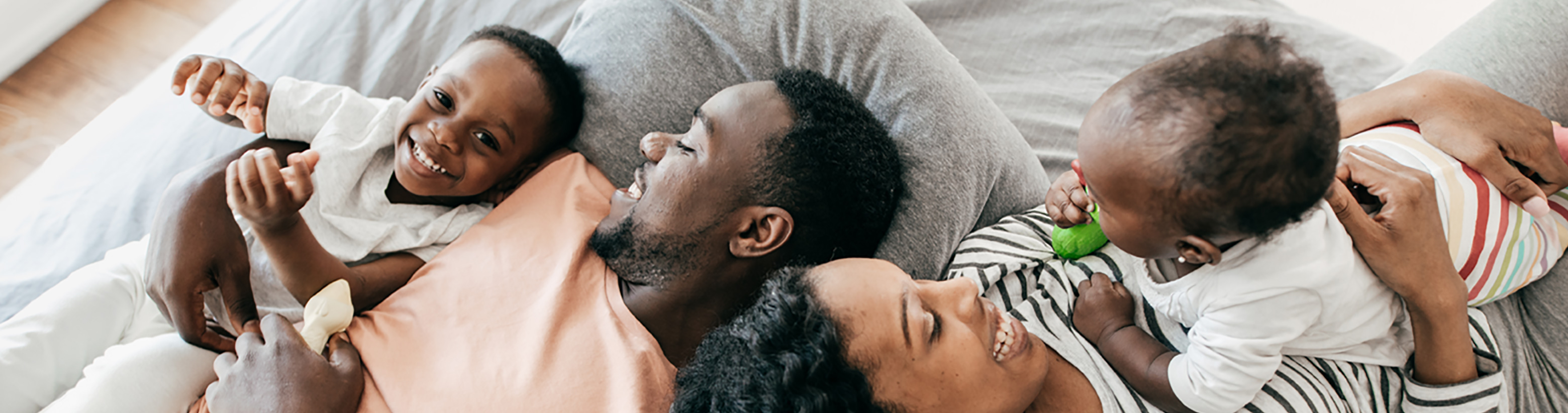 parents laying with children