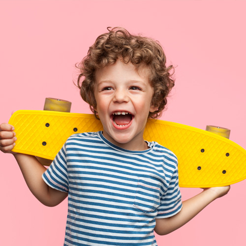 little boy with penny board skateboard