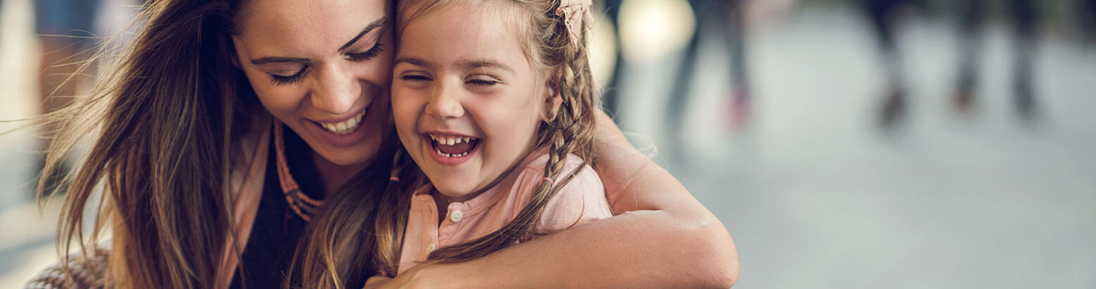 mom and daughter laughing