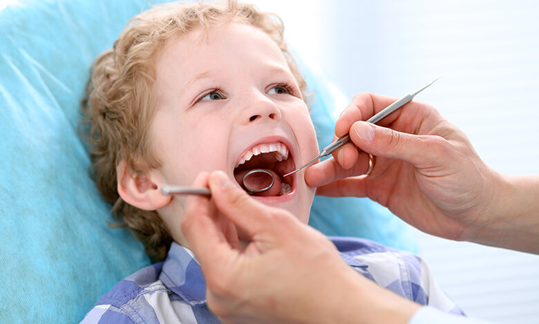 boy at pediatric dentist