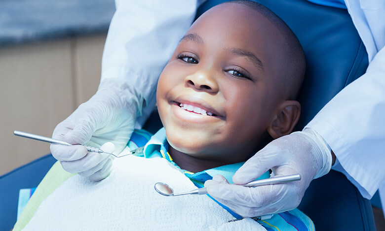 boy smiling at dentist