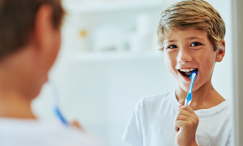 boy brushing his teeth