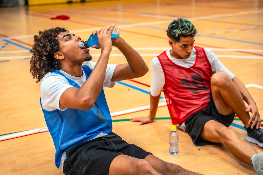 teens drinking sports drink
