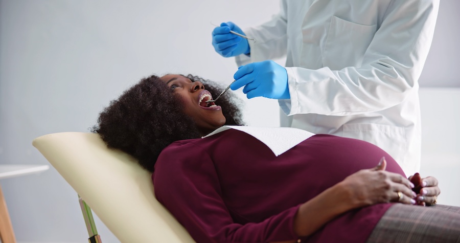 pregnant woman at dentist for dental care during pregnancy